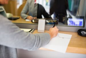 people finance concept customer with pen paper writing application bank office