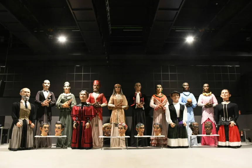 Gegants i caps de nanos del Corpus de Xàtiva exposats en una sala abans de viatjar a Tafalla